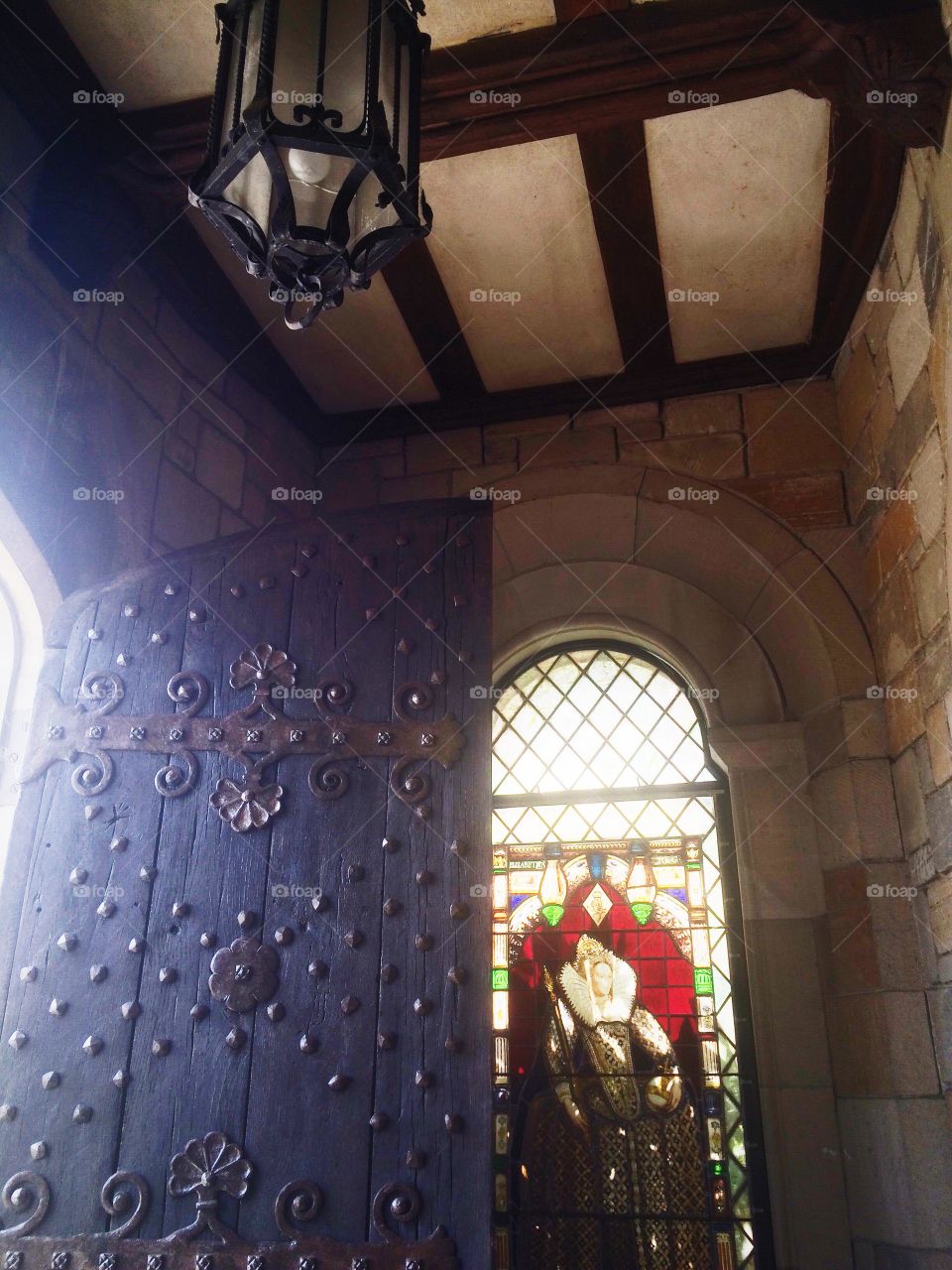 Castle Entry. Stained glass and an ornate door 
