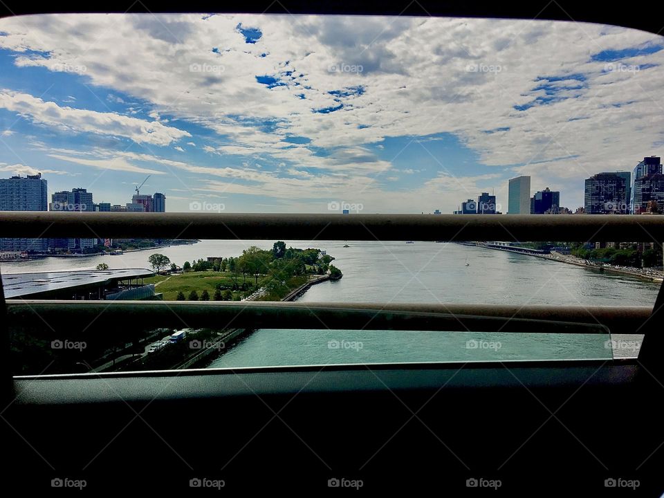 Crossing the 59th St or Queensborough Bridge on the way to Newtown Creek in LIC in 2020. The East River encloses Roosevelt Island, Manhattan is visible on  the left and Queens on the right. Hypnotic Productions