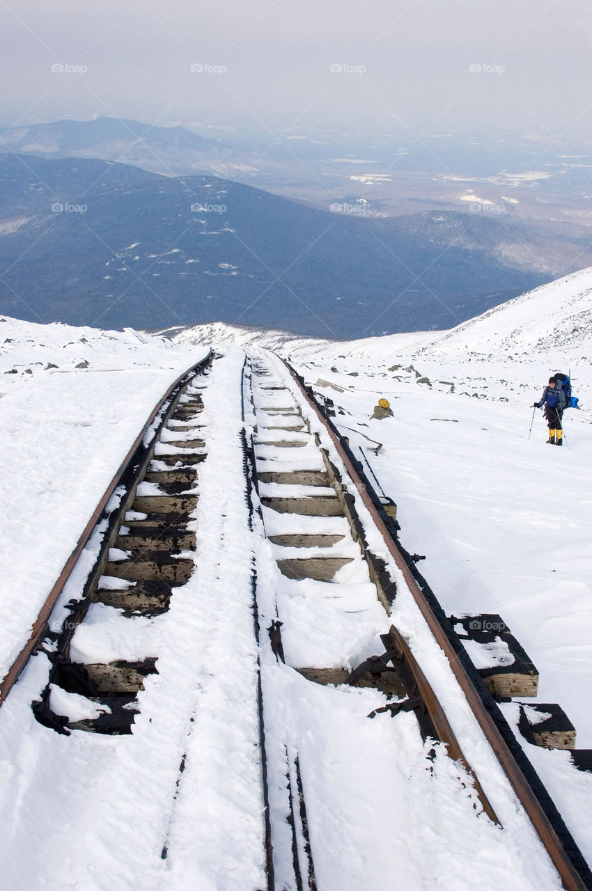 Backpacker approaching the cog railway on Mount Washington in New