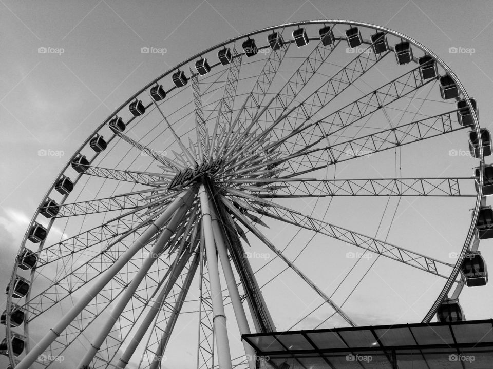 The Wheel. Ferris wheel in action in a theme park.