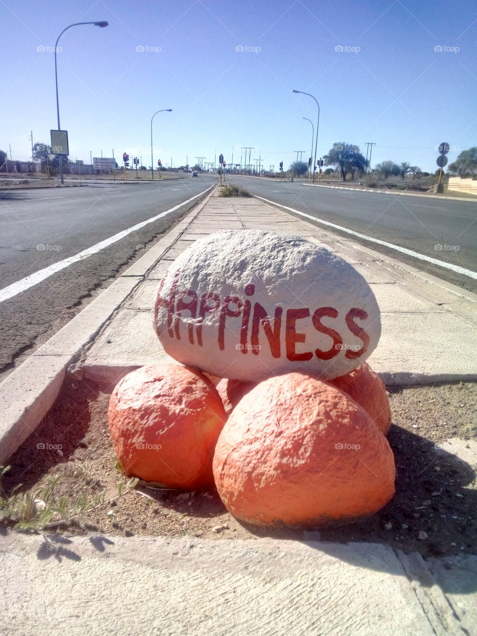 Hapiness written on stone on flyover