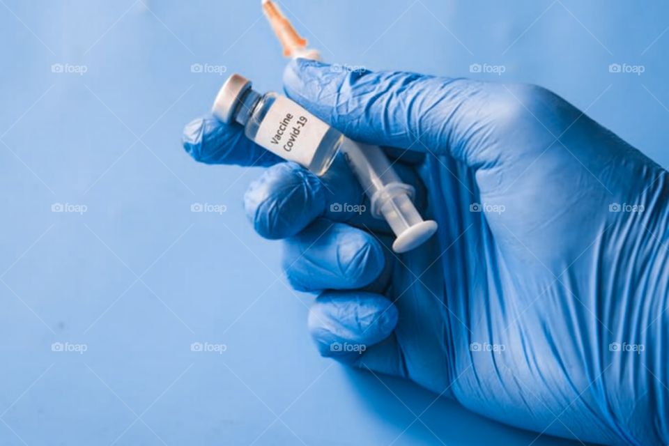 Covid-19 Vacine Syring in hand