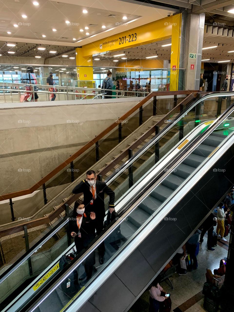 flight attendants on the airport escalator