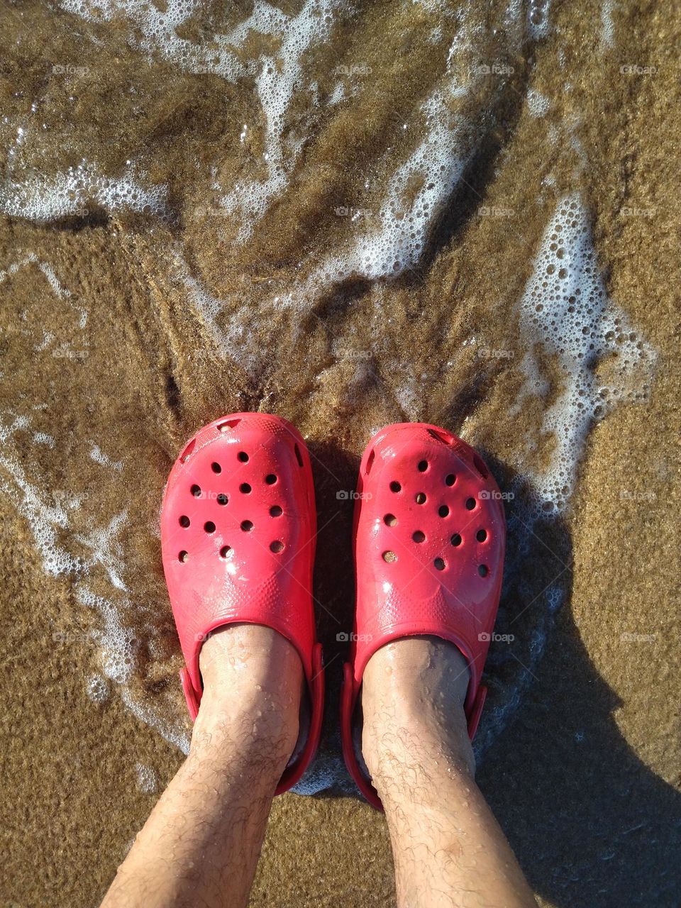 foot and water with sand