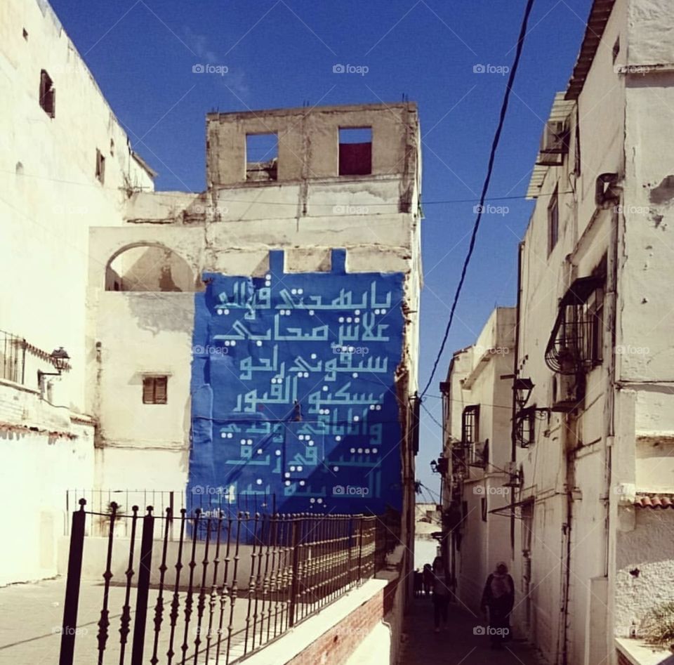 A woman walking in El kasba streets 