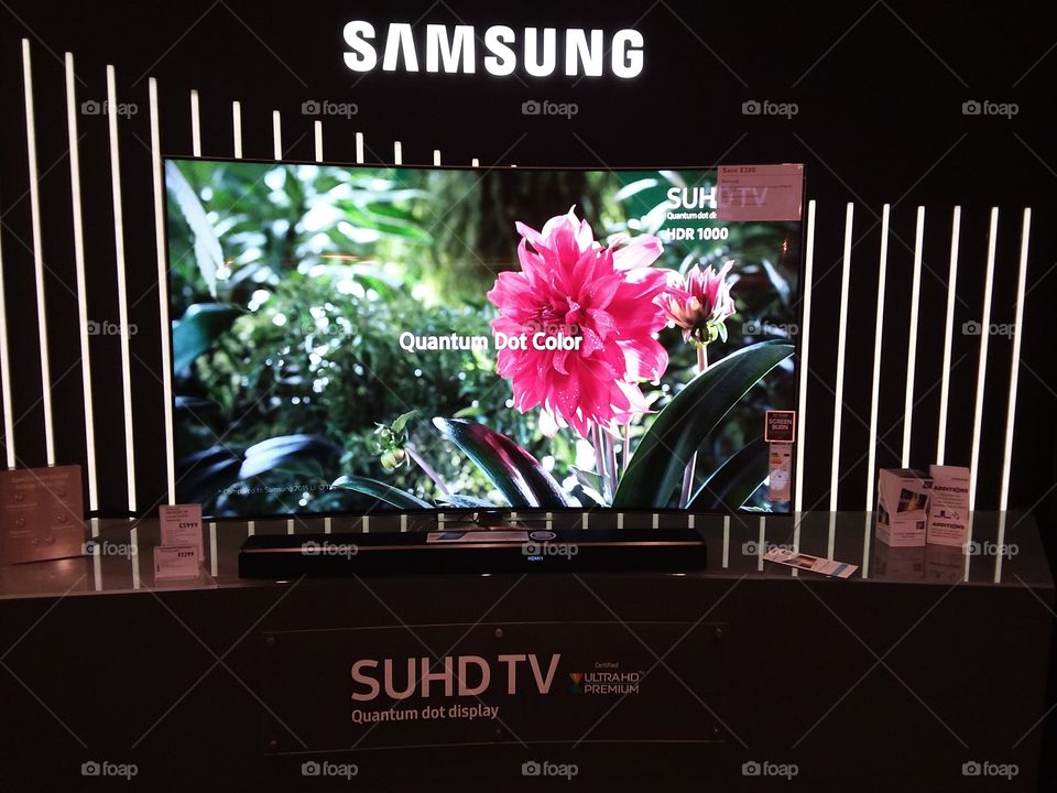 Samsung premium room featuring Quantum dot technology televisions and Dolby Atmos cinematic soundbar