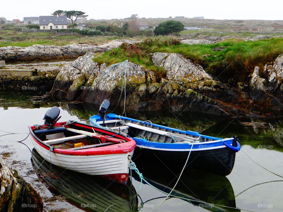 Boats moored on lake