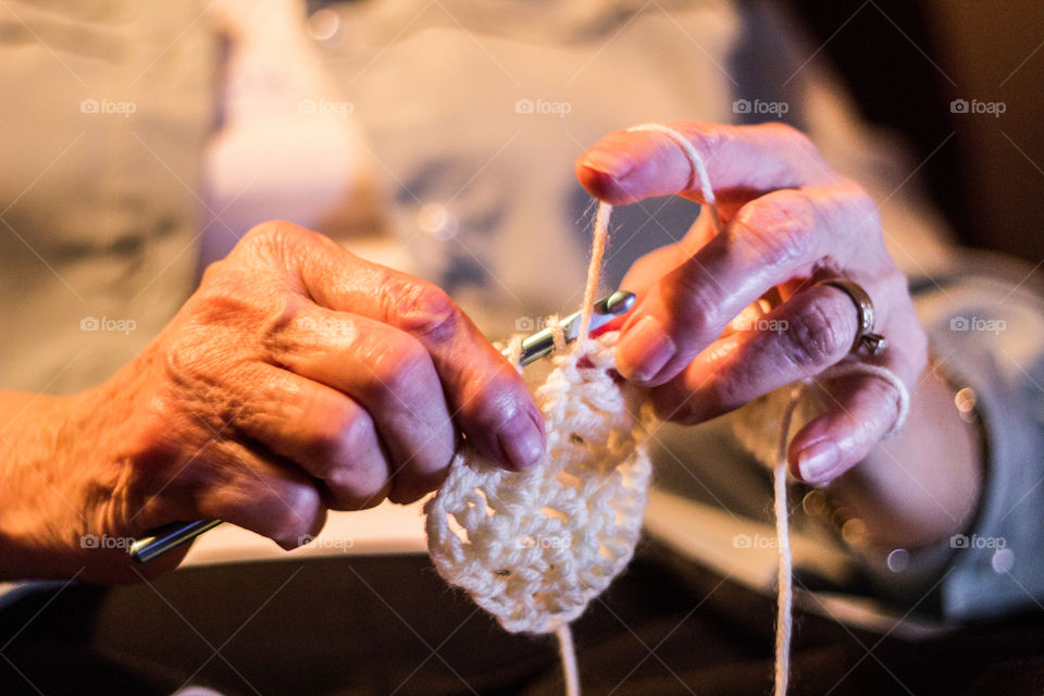 Close-up of women crocheting