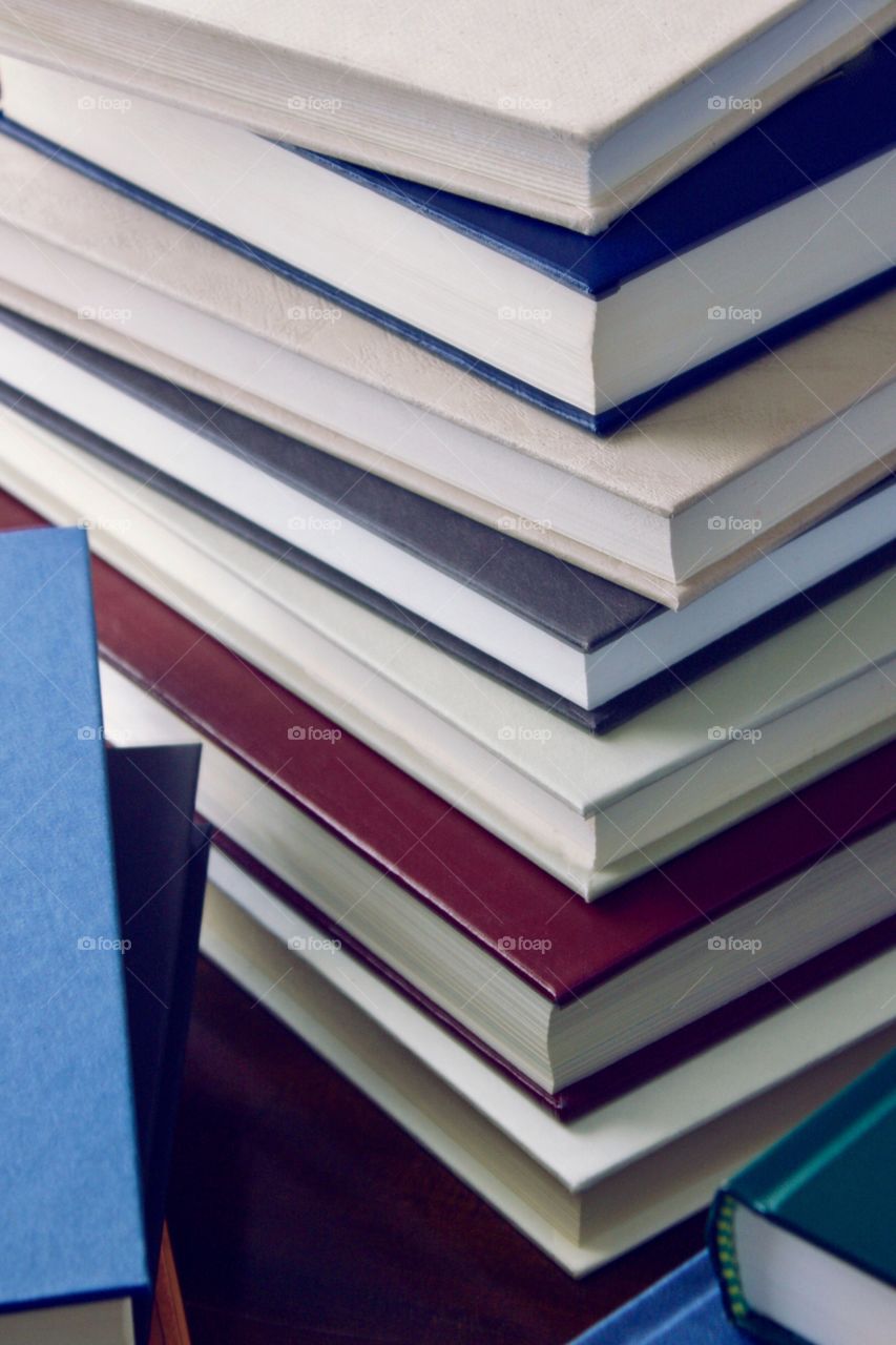 Stacks of books with plain covers