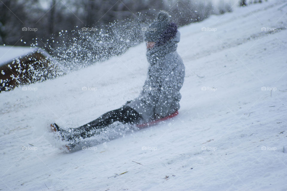 Girl sledding