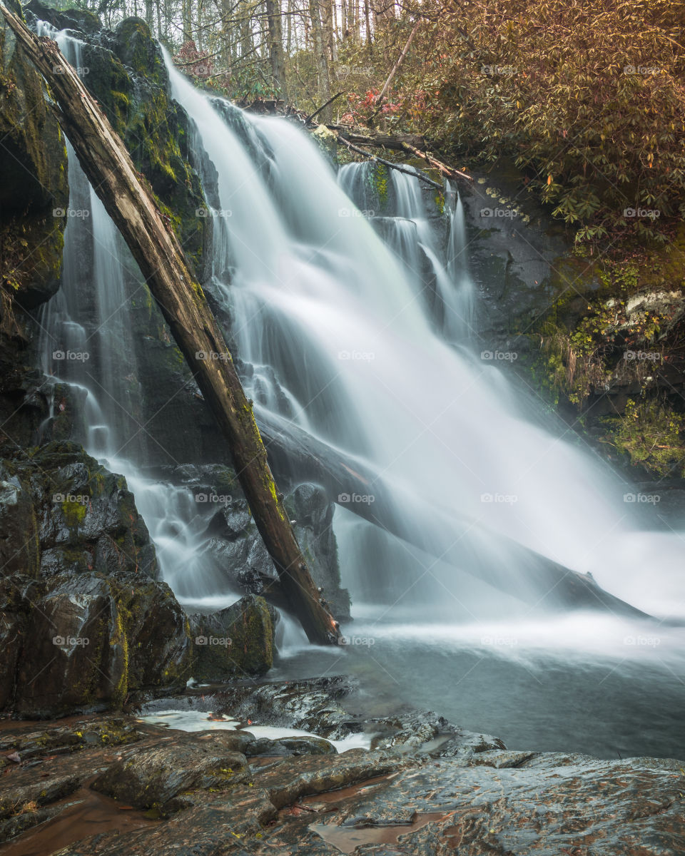 Beautiful cascading water in autumn