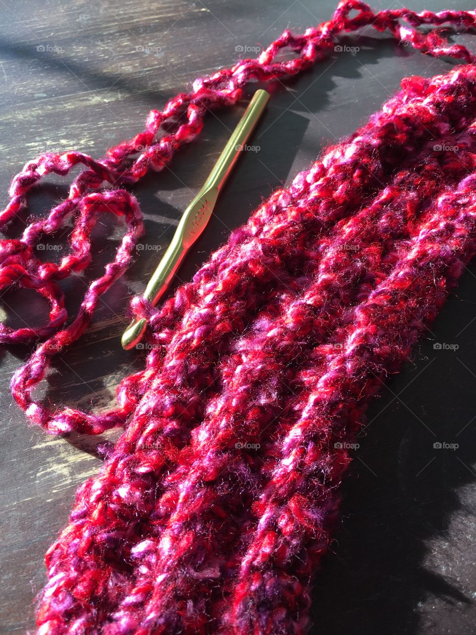 Red yarn and Crochet hook 