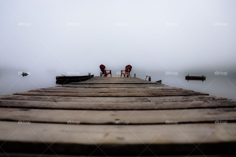Empty pier on a foggy morning 