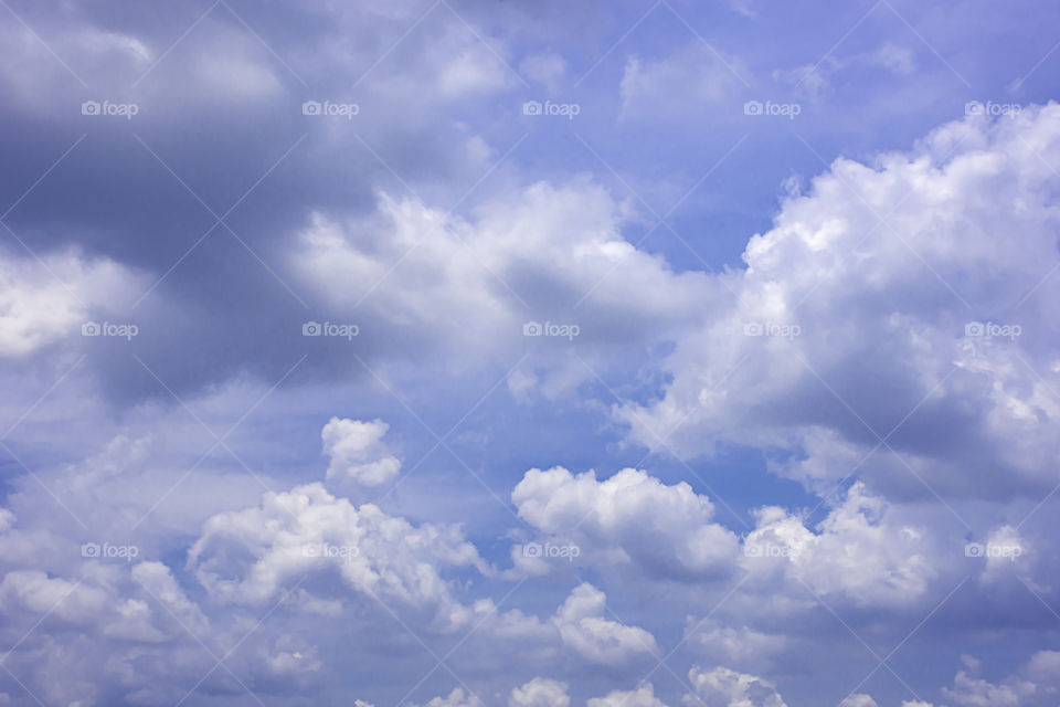 The beauty of the sky with clouds and the sun.