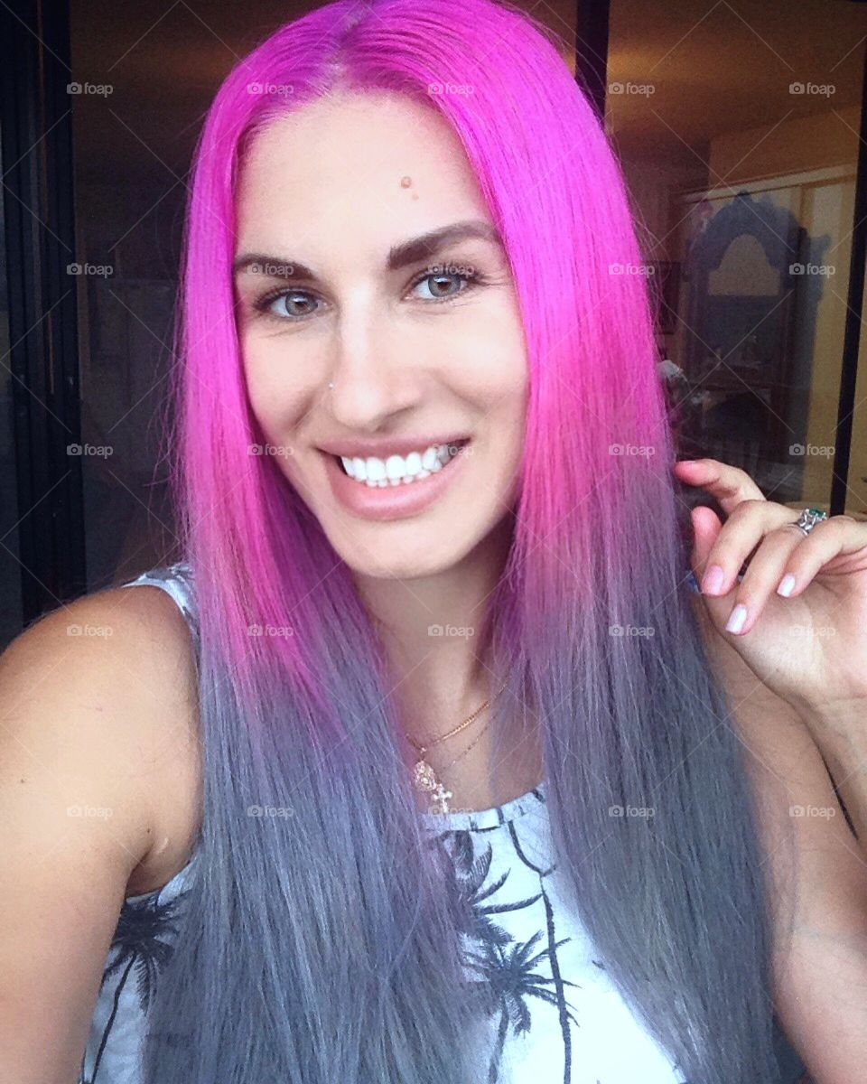 Stylish woman with pink dye hair