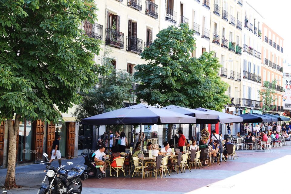 A street with outdoors restaurants in a row in Madrid 