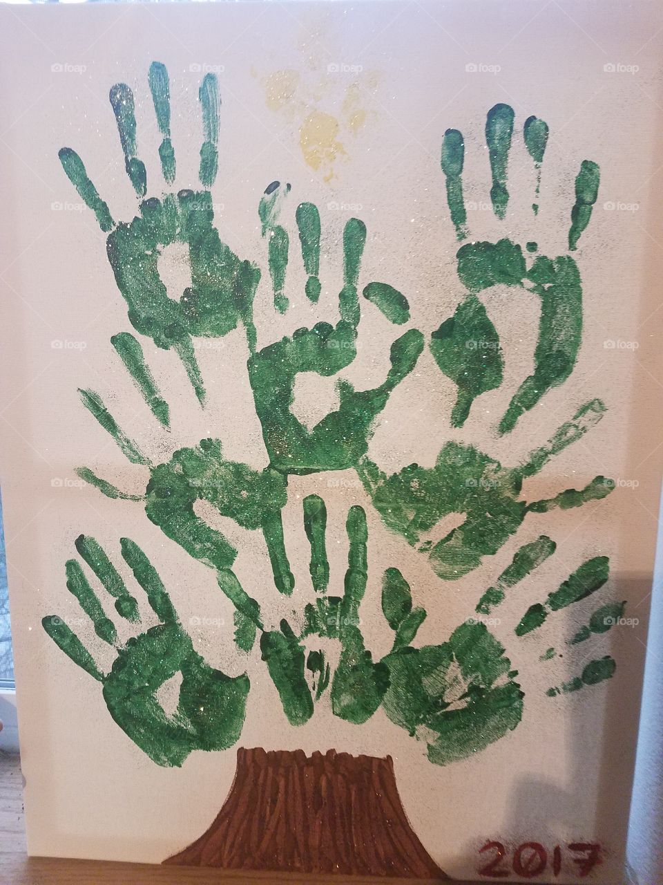 Green family handprint tree
