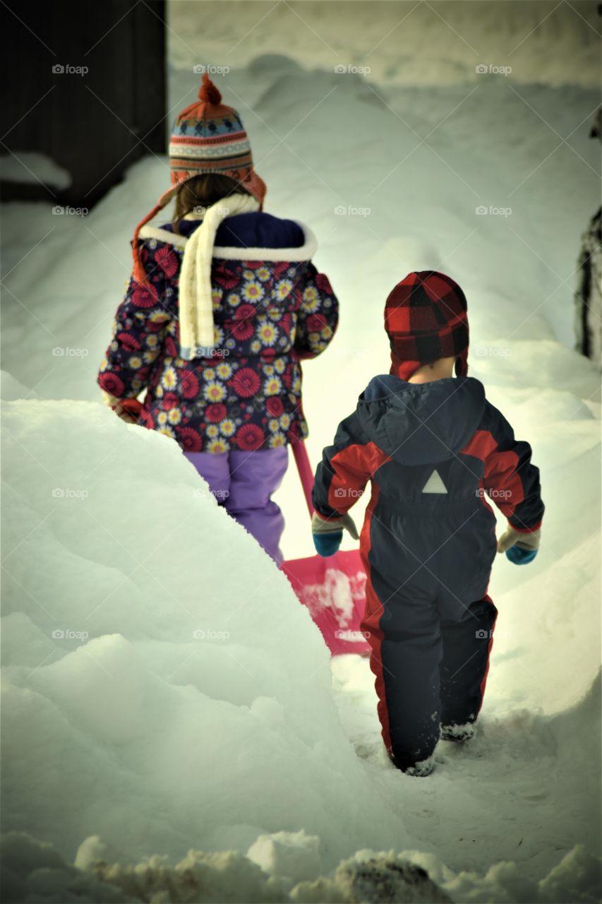 kids shoveling snow