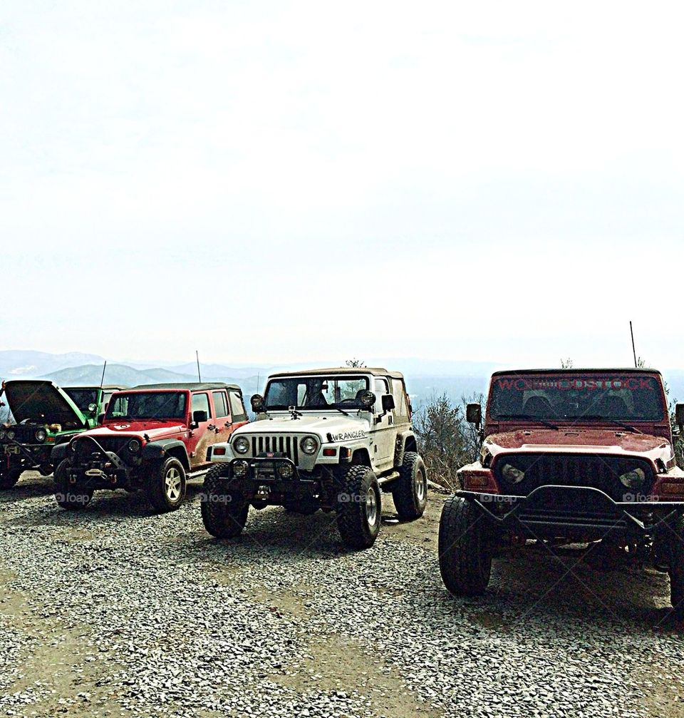 Jeeps on top of a mountain 