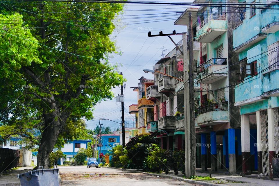 Poor residential area of Havanna with colourful flats and empty street