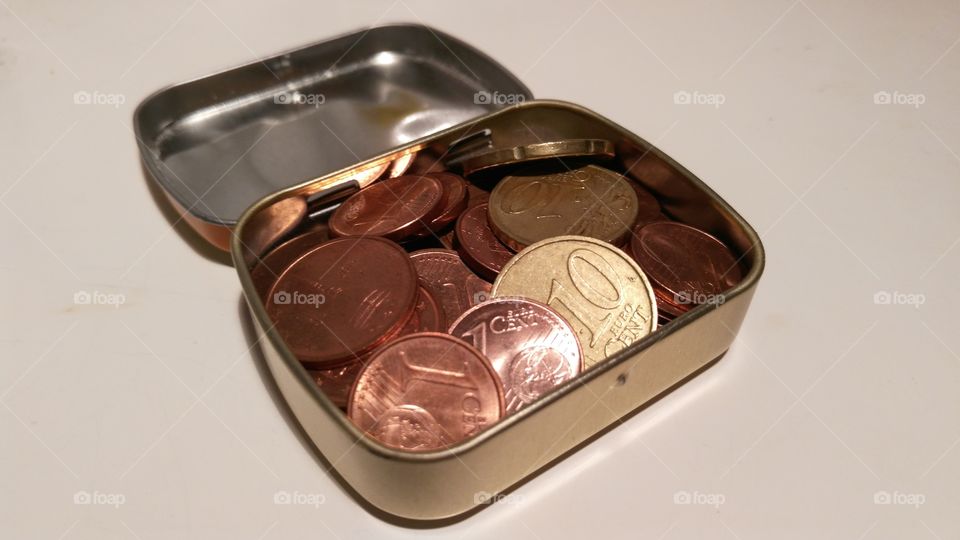 money coins in a iron box