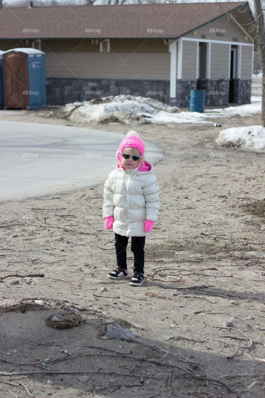 Sassy sunglasses. Toddler spotted at the beach in winter