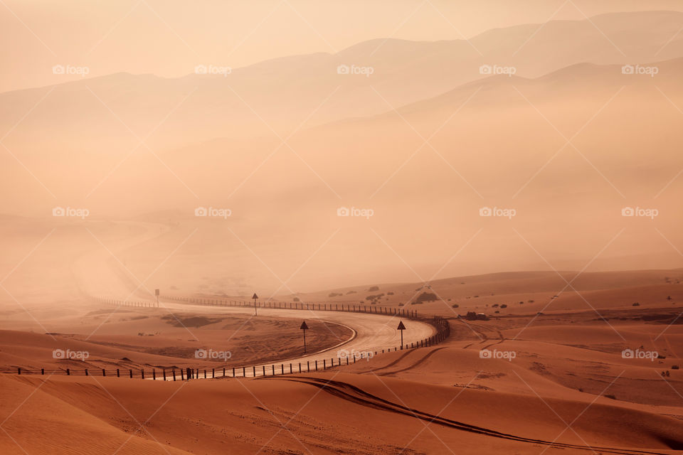 An empty winding road n the desert