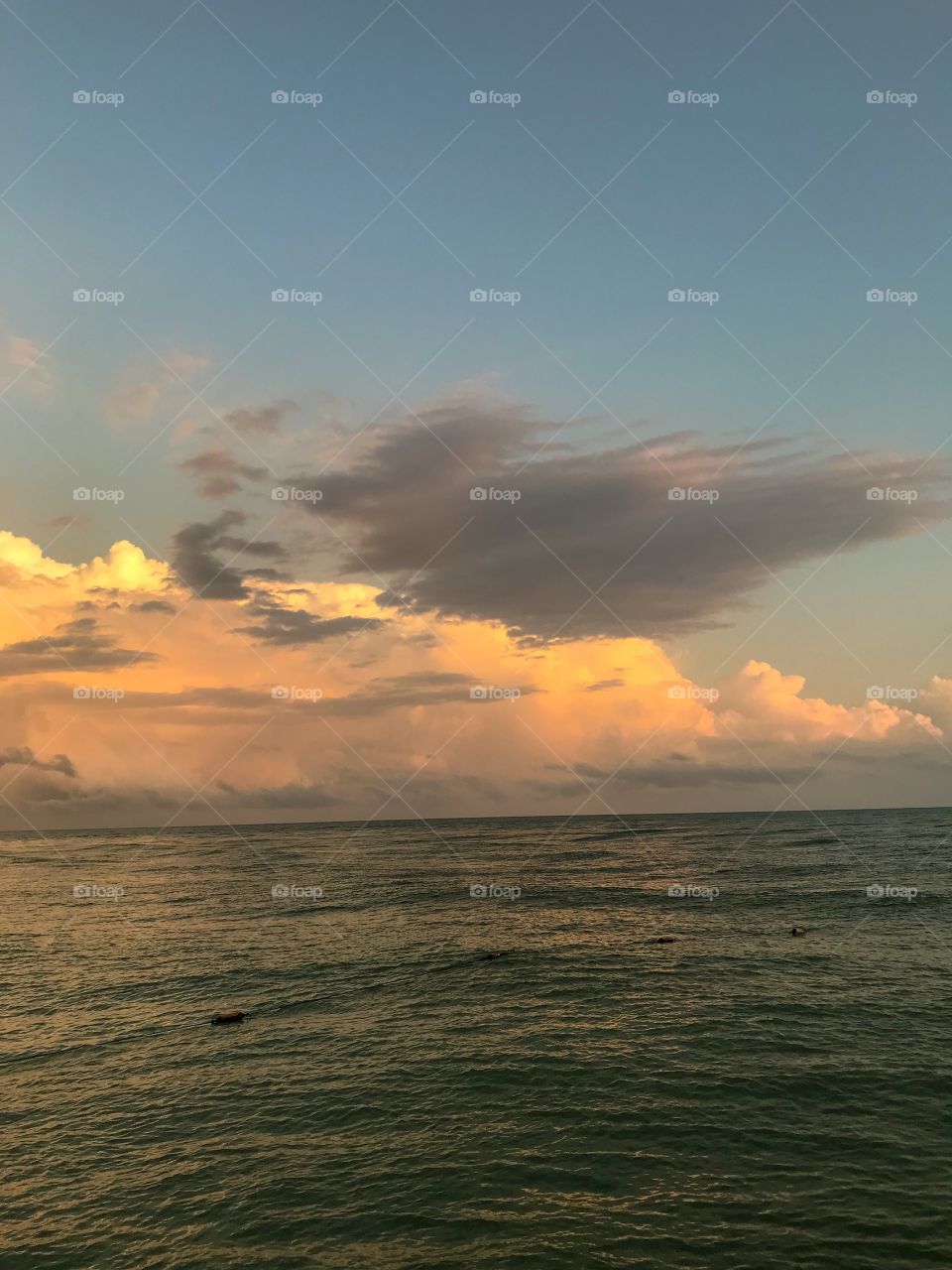 Beautiful clouds formation after an earlier shower at sunset