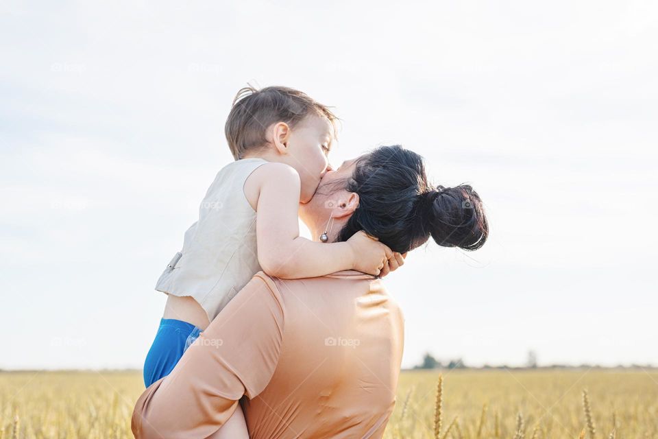 loving family of mother and son in countryside