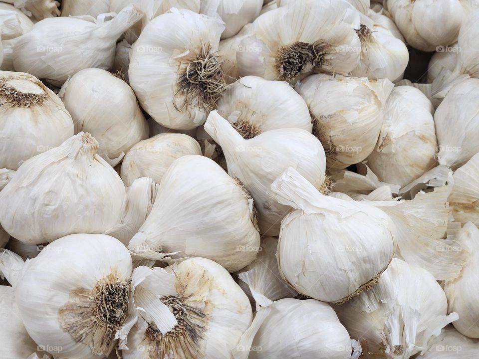 close up of white garlic cloves from local market