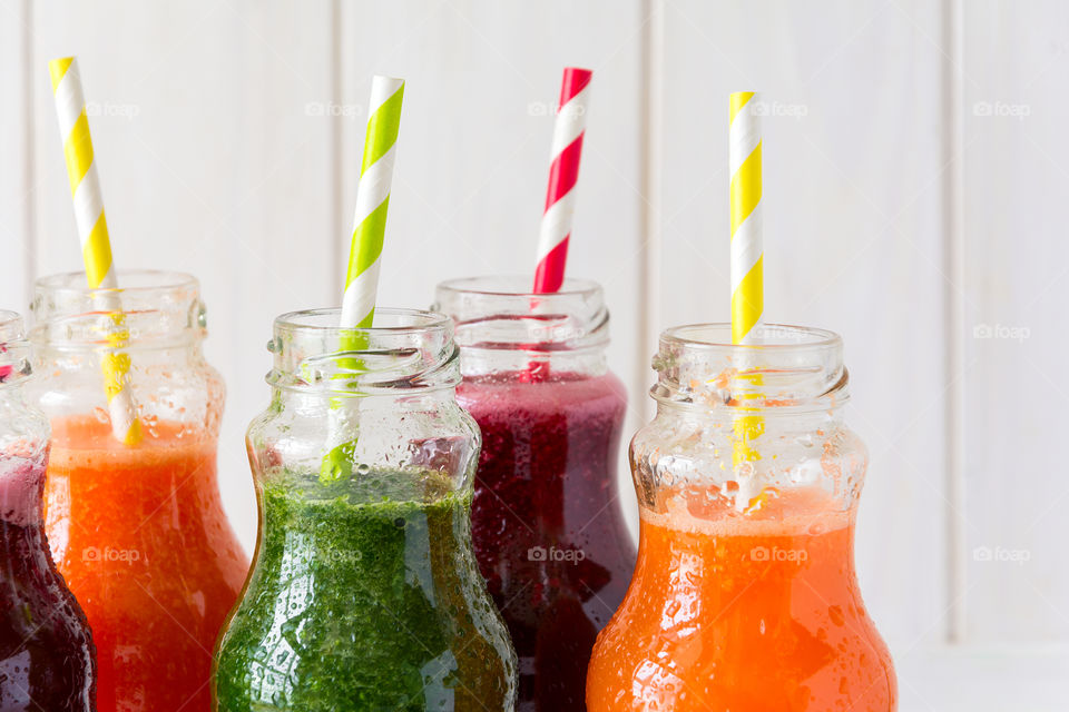 Bottles of colorful smoothies