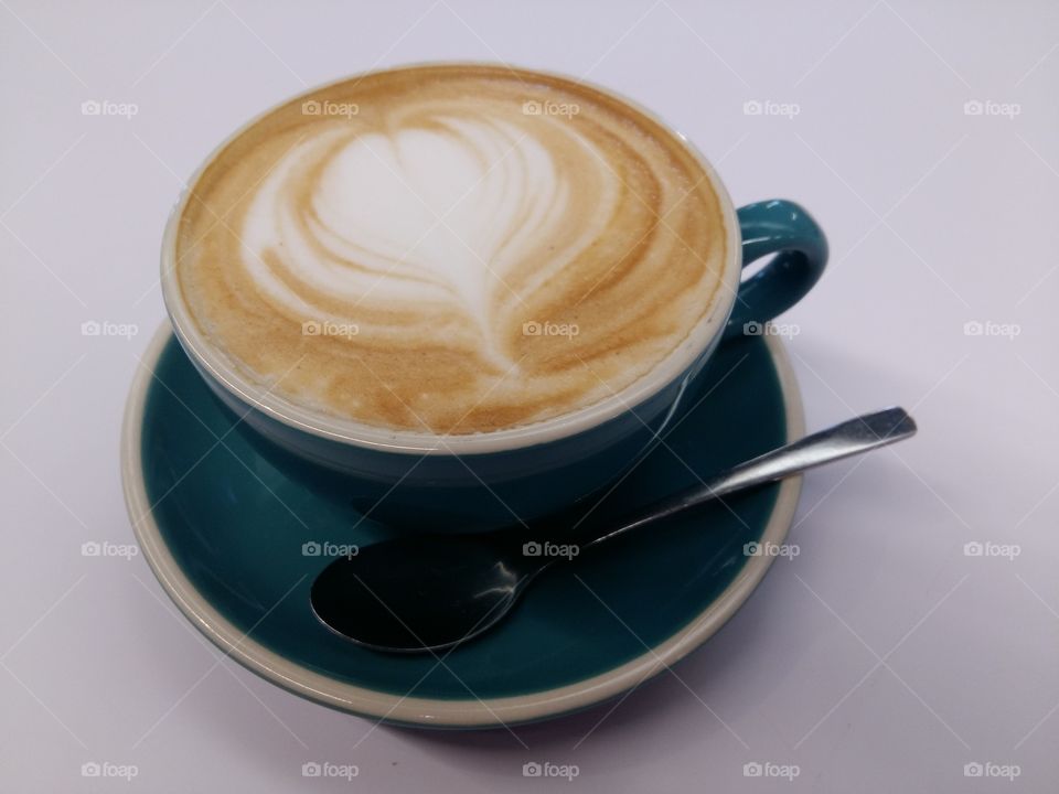 Vegan almond milk cappuccino on white background