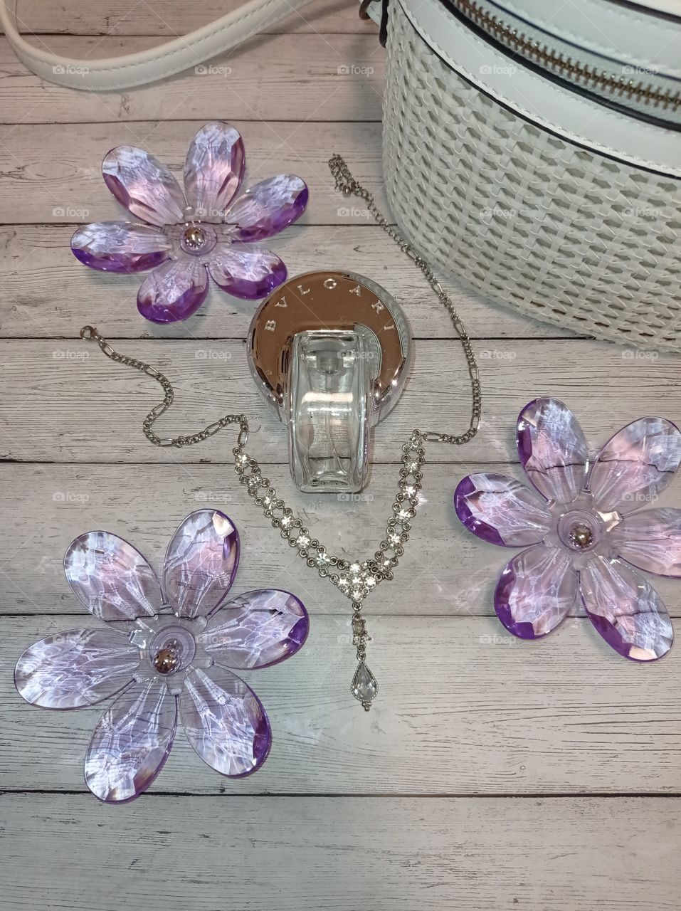 perfume, bag and flowers