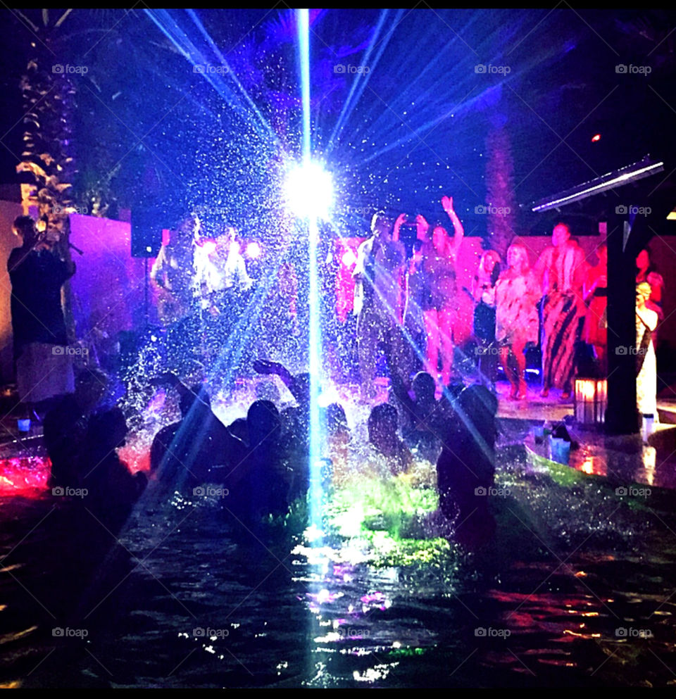 Only, only in my city would the whole wedding party, fully dressed jump into the reception center swimming pool! It was all fun and I captured it with my camera!