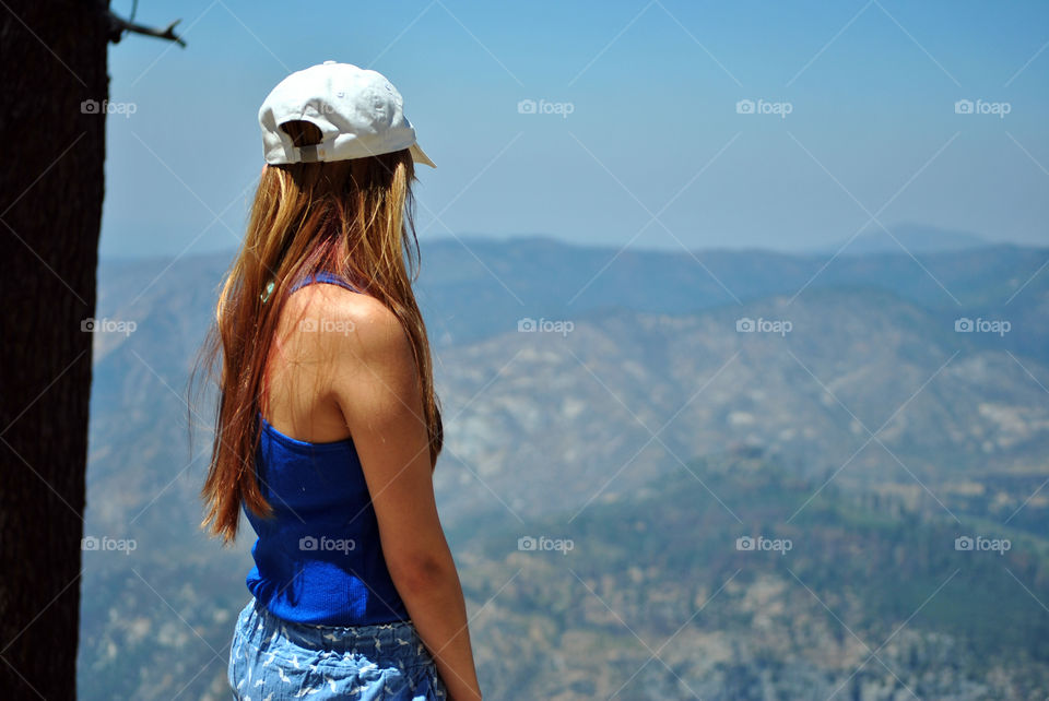 Girl looking far, mountain view hike