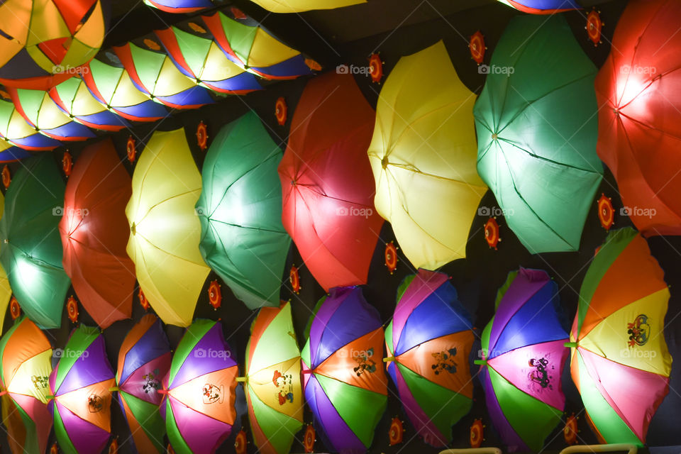 Decorated colorful umbrella. Colorful umbrellas background. View from street decoration. Selective focus. Closeup.