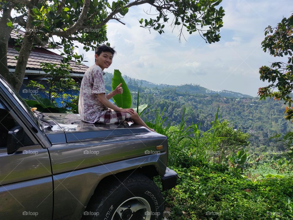 young man on an offroad car