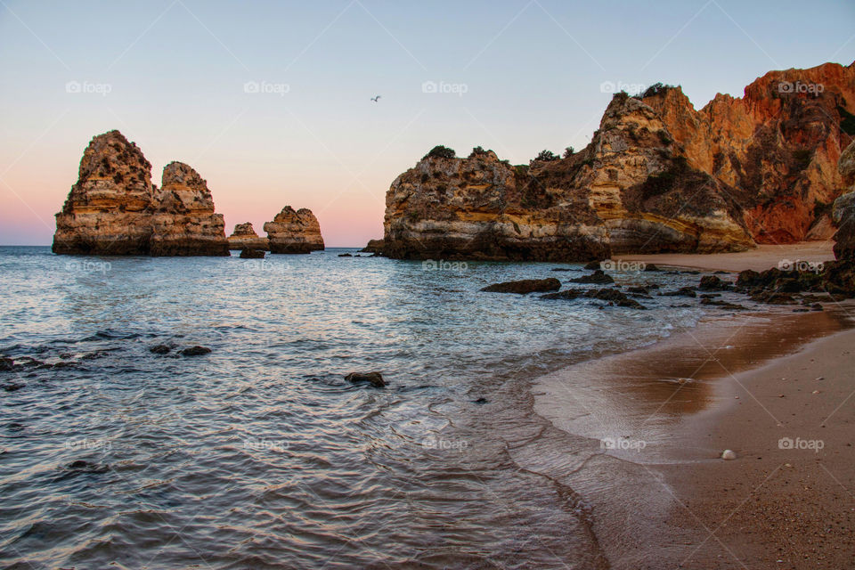 Scenic view of a beach against clear sky