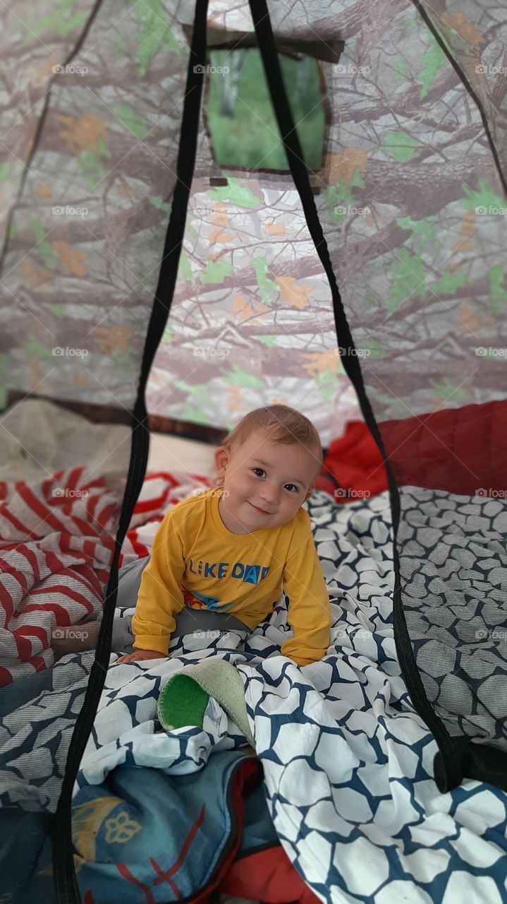 Rest with a child in a tent