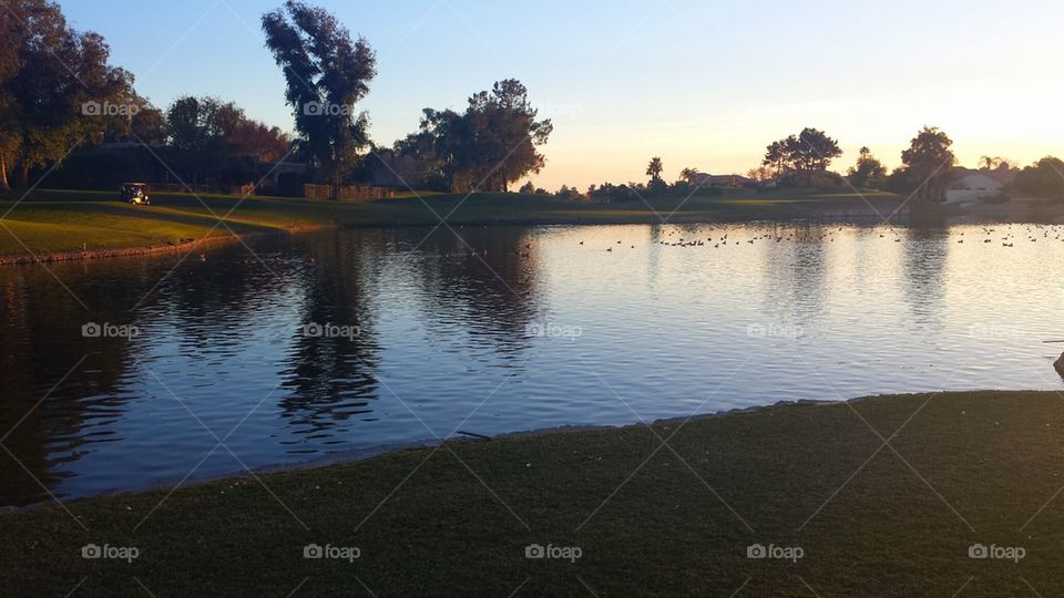 Golf course sunset on the lake