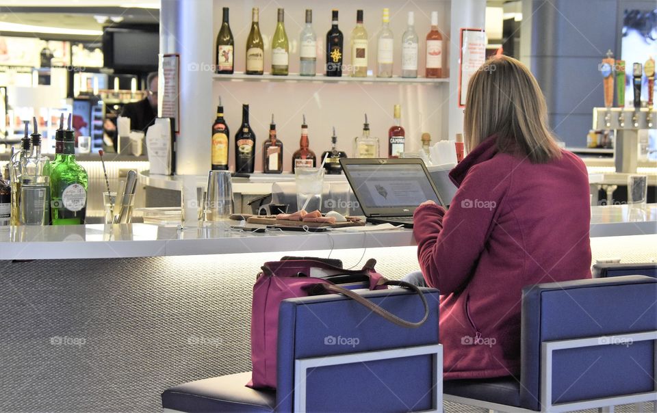 Lady sitting at a bar