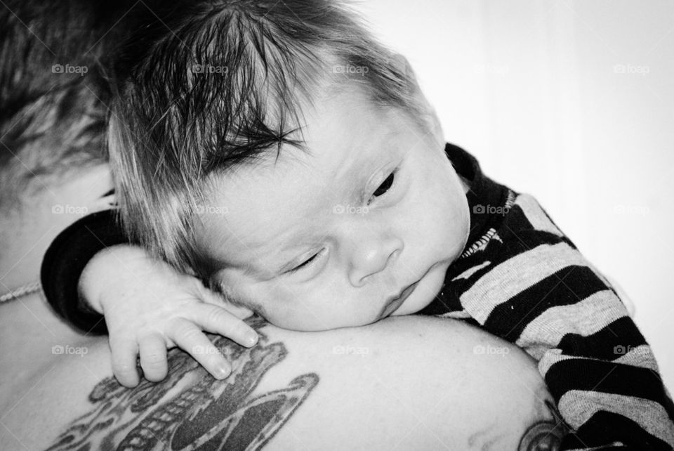 Boy on fathers shoulder