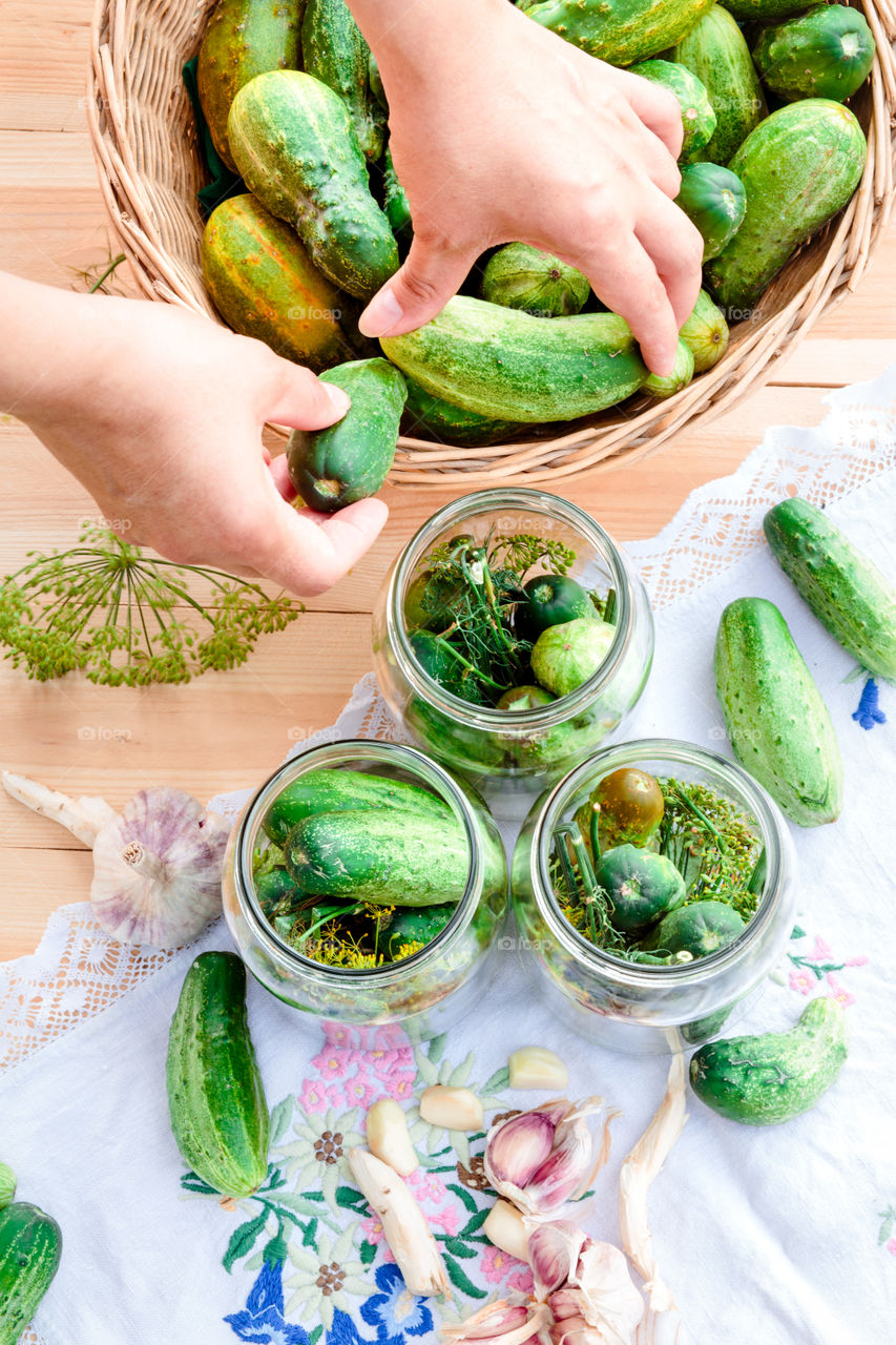 Pickling cucumbers. Pickling cucumbers with home garden vegetables and herbs