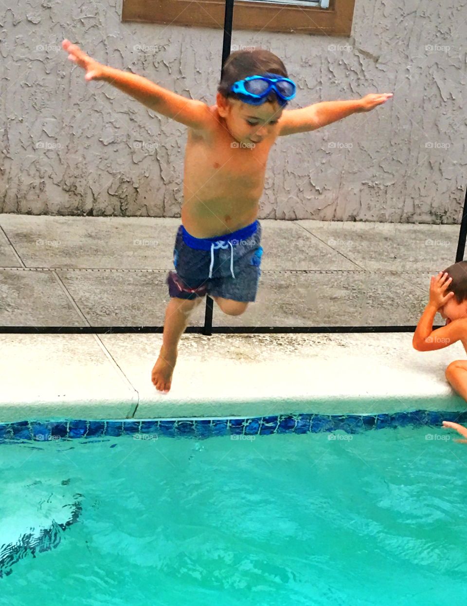 Small child diving into the pool