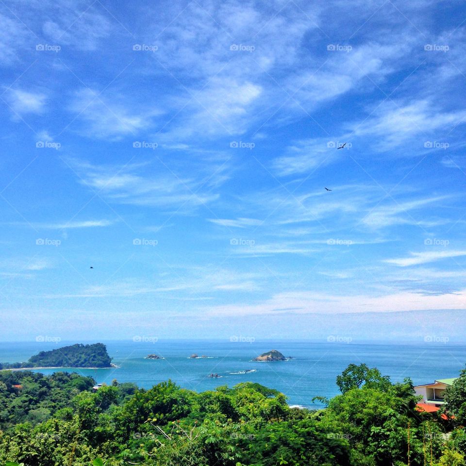 Island against cloudy sky