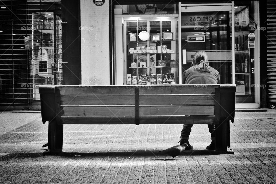 A woman sitting on the bench