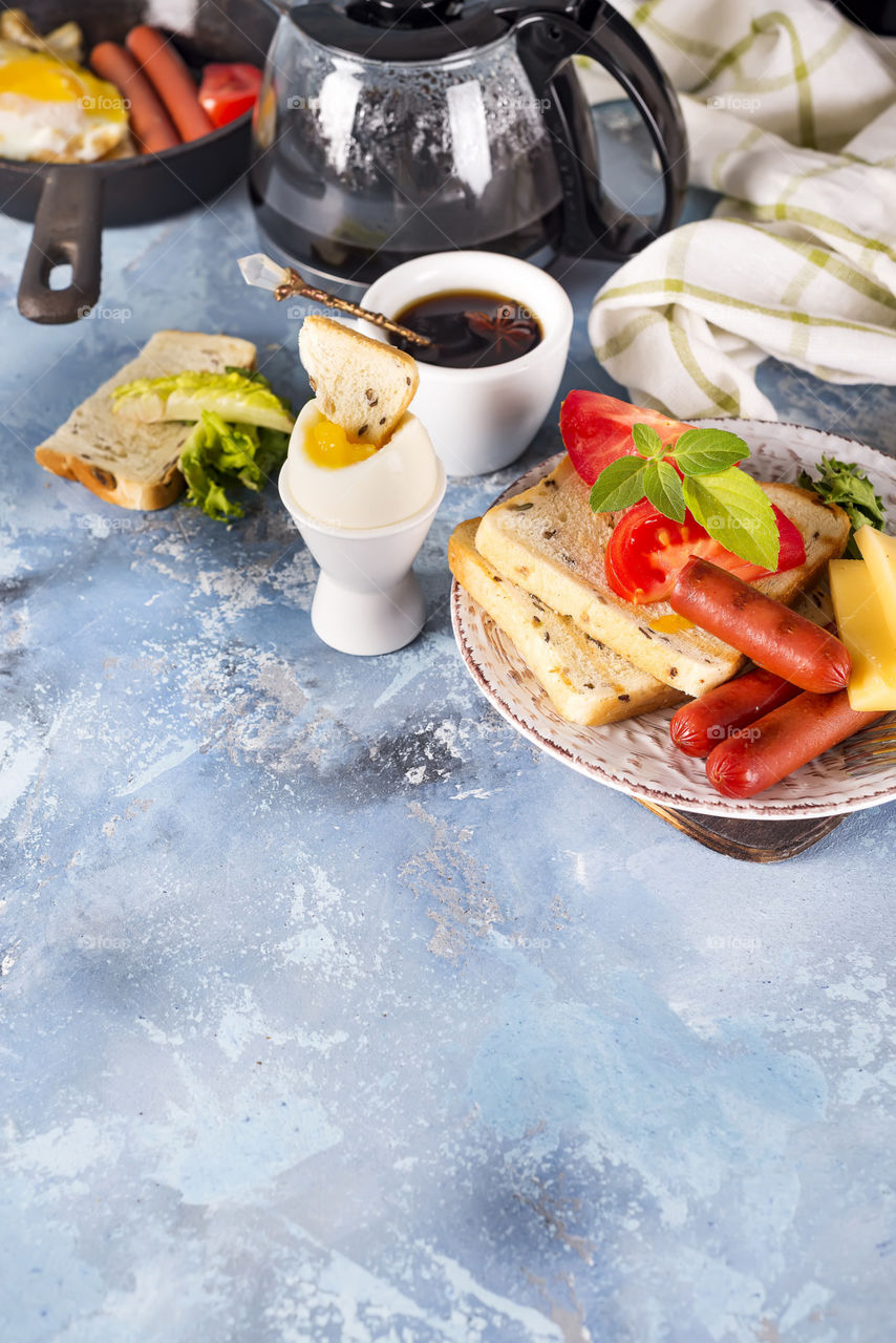 breakfast with coffee, egg and tost