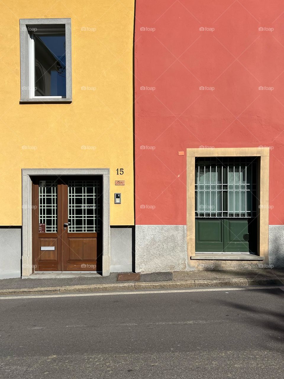Street photography. Colors. Doors and window. Yellow with orange colors.
