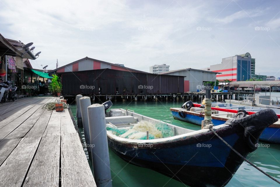This is Chew Jetty in Penang, Malaysia, named after a chinese clan. This water village is more than a century old and is under UNESCO world heritage.