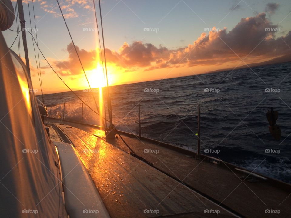 Sunset sailboat starboard warm ocean wooden decks 